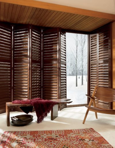 Brown faux wooden roller shades in bedroom