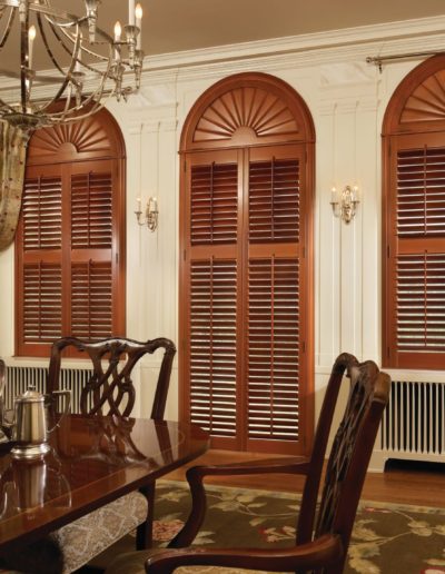 Wood floored dining room with red oak shutter blinds