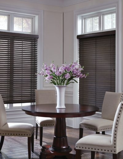 Brown wooded shades in a modern dining room